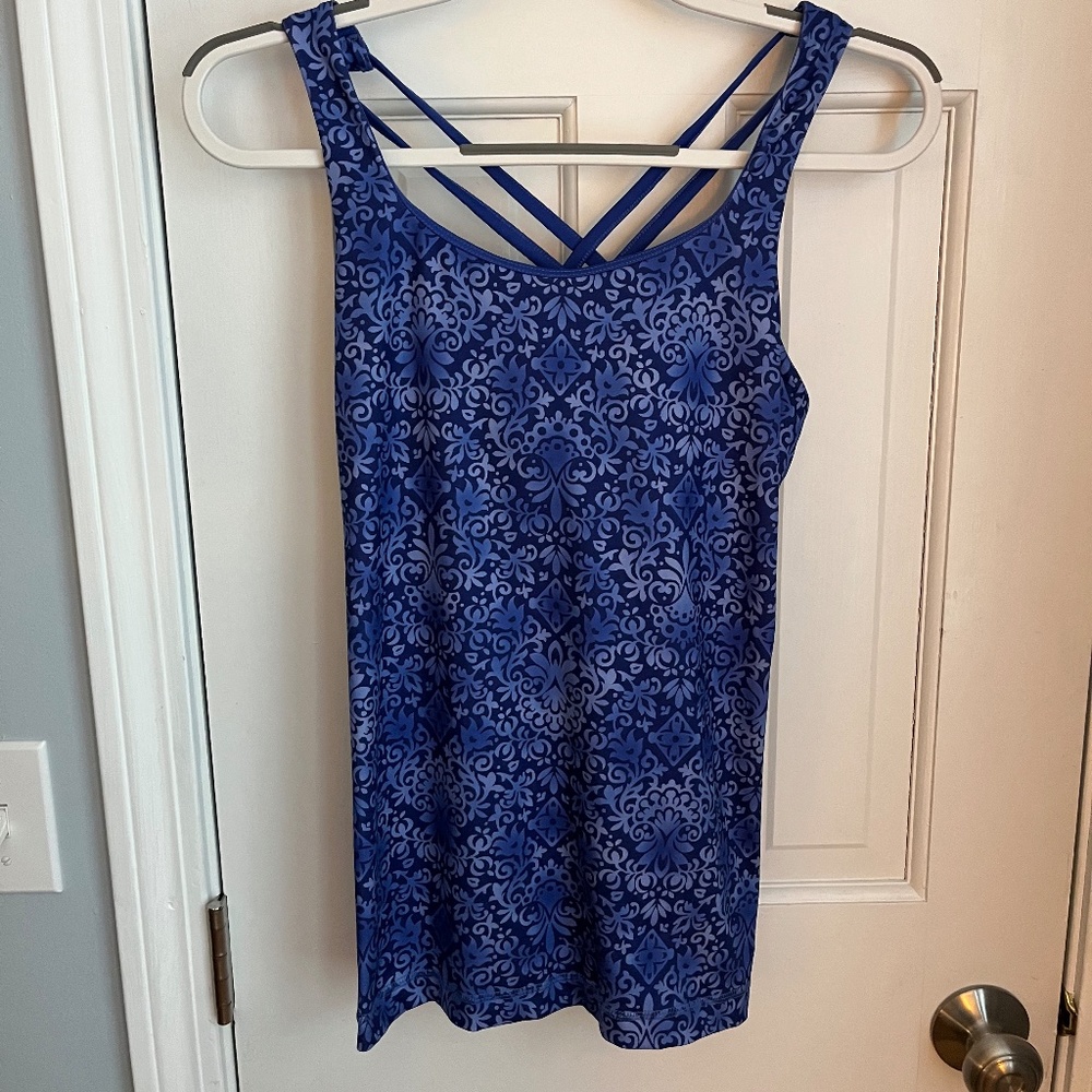 Pretty blue workout top with crisscross back.  Size M